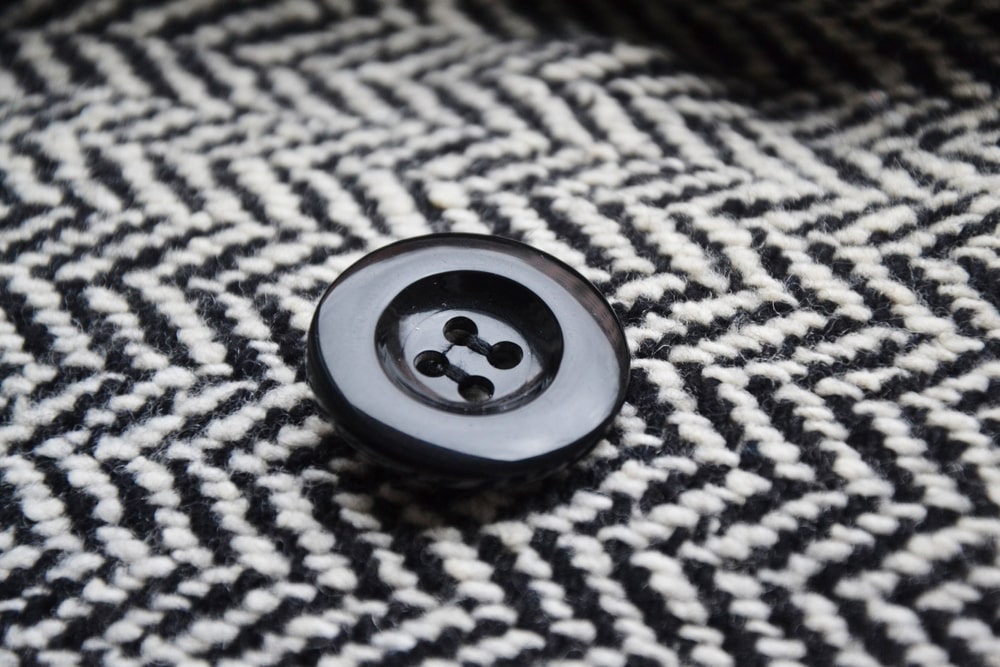 Button on the black and white chevron design pattern